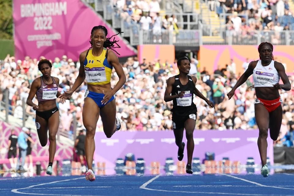 Sada Williams of Team Barbados crosses the finish line to win gold (Getty Images)