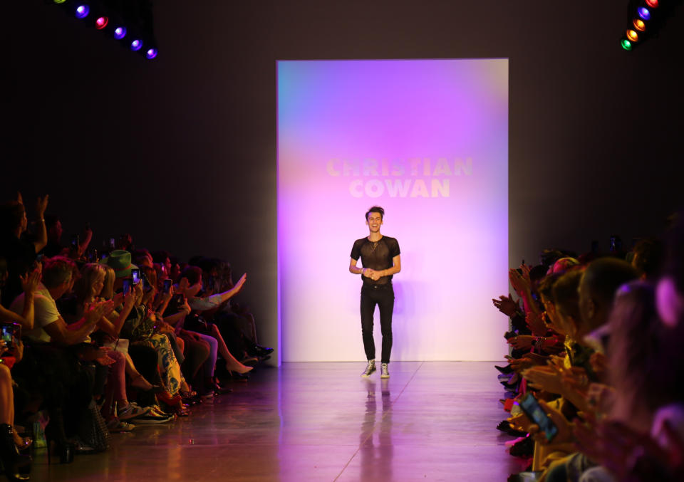 Christian Cowan acknowledges the audience applause after his collection was shown during Fashion Week in New York on Tuesday, Sept. 10, 2019. (AP Photo/Ragan Clark)
