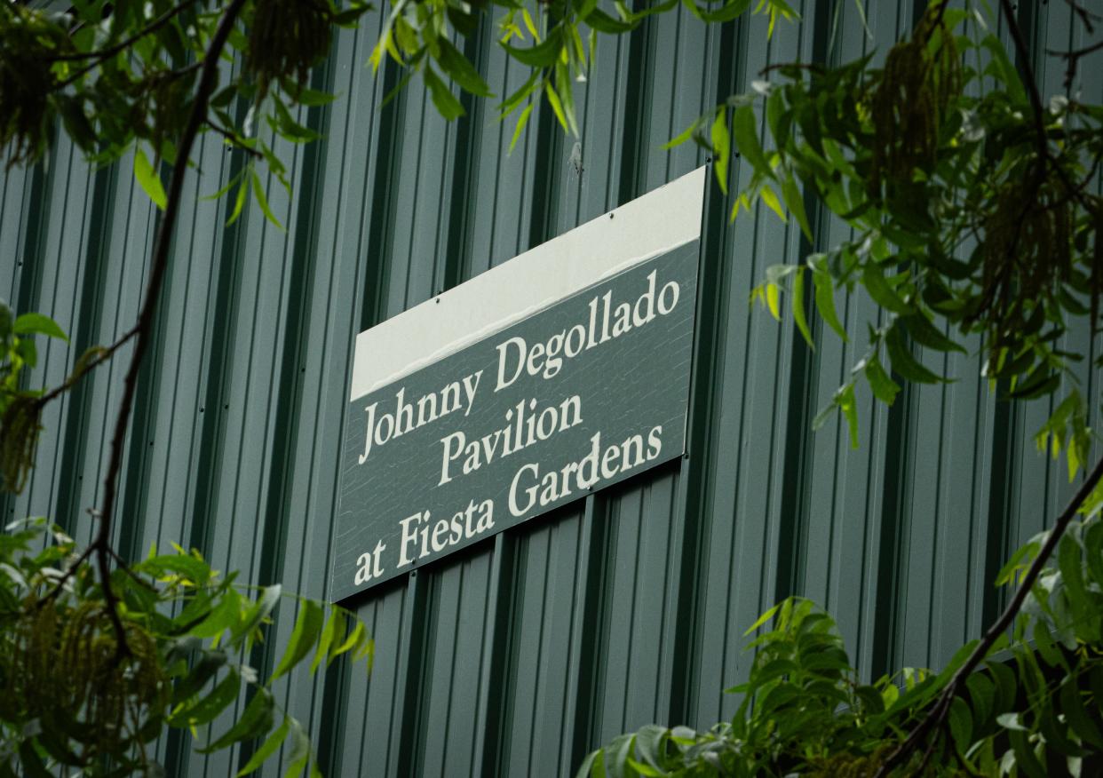 A sign dedicates the pavilion at Fiesta Gardens to Austin conjunto music legend Johnny Degollado, who organized many festivals and celebrations at the park and was instrumental in getting a roof built for the pavilion to shield bands and audiences from the Texas sun.