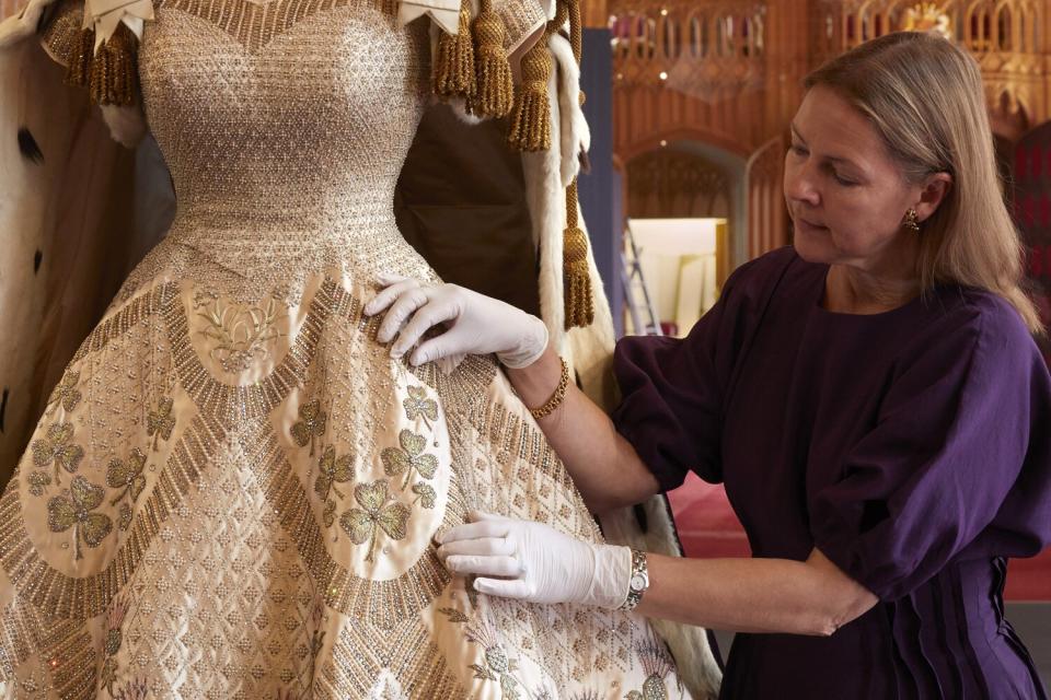 Curator Caroline de Guitaut puts the finishing touches to the display at Windsor Castle