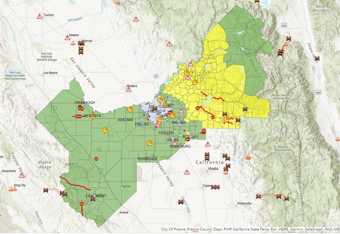 A map updated Sunday, March 12, 2023, from the Fresno County Sheriff’s Office continues to show evacuation warning areas in yellow in the foothills and mountains of eastern Fresno County as storms continue hit the region. New rain and melting low-elevation snow create the danger of more flooding in the Valley.