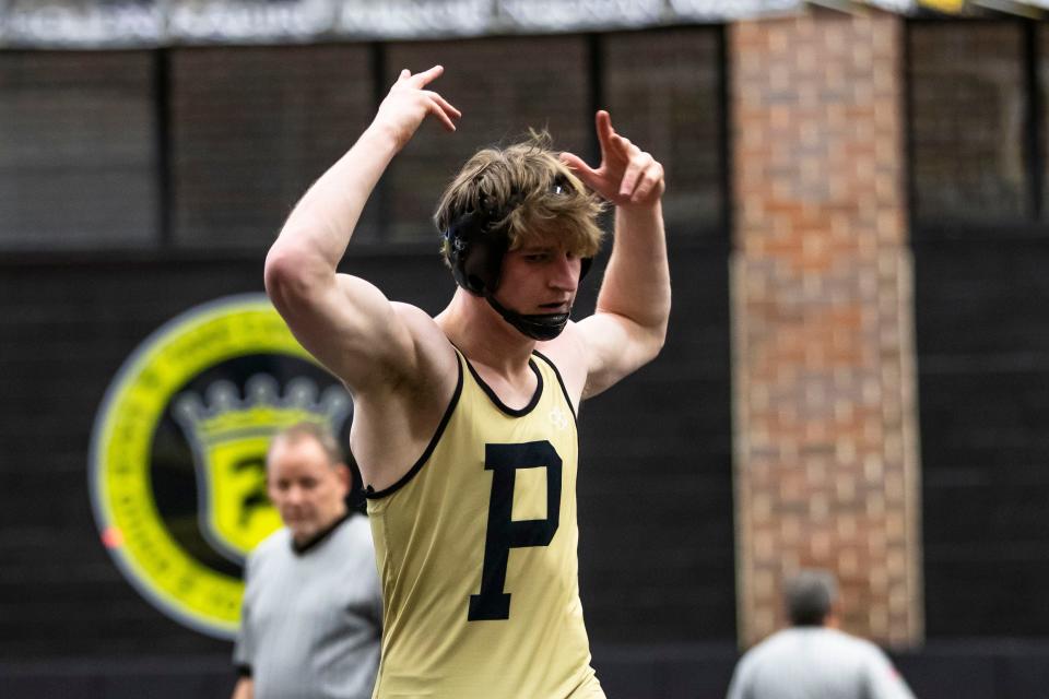 Penn's Wesley Harper celebrates winning the 150-pound championship match of the regional wrestling meet Saturday, Feb. 3, 2024 at Penn High School.