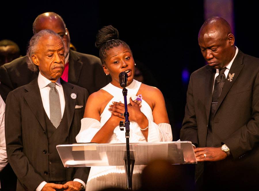 Flanked by Reverend Al Sharpton, left and Trial and Civil Right Attorney Benjamin Crump, right, Pamela Dias, center, mother of Ajike “AJ” Shantrell Owens, spoke, thanked and said that the fight is not over so that her daughter can have justice, during her daughter’s funeral Monday. [Doug Engle/Ocala Star Banner]2023