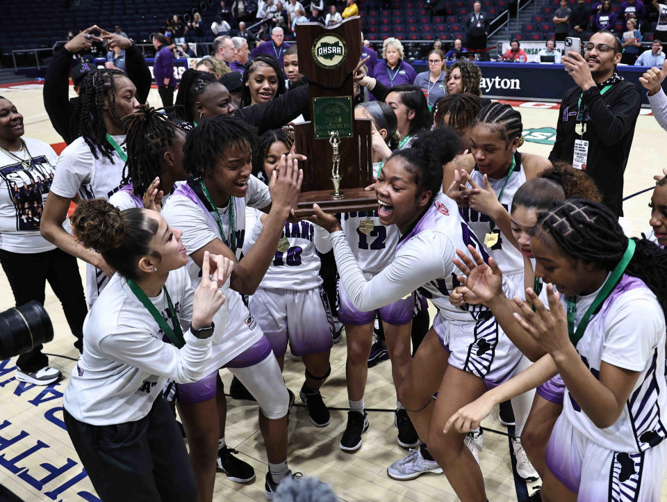 Africentric players celebrate after beating Ottawa-Glandorf for the Division III state championship Saturday.