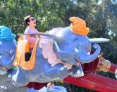 <p>The Disney actress had a ball on the Dumbo ride at the Happiest Place on Earth. We assume her sons with Josh Dallas, Oliver and Hugo, did too! (Photo: Fern Sharpshooter/Splash News) </p>