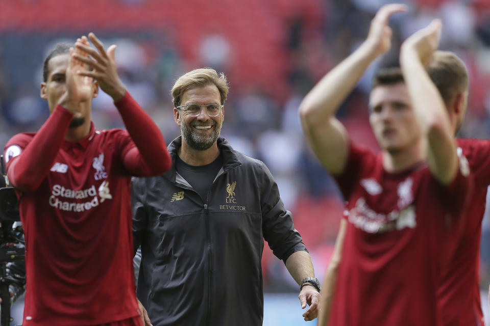 Liverpool's coach Jurgen Klopp center, celebrates with Liverpool's players after winning the English Premier League soccer match between Tottenham Hotspur and Liverpool at Wembley Stadium in London, Saturday Sept. 15, 2018. (AP Photo/Tim Ireland)
