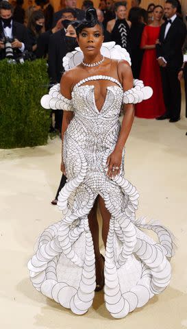 <p>Sean Zanni/Patrick McMullan via Getty</p> Gabrielle Union at the 2021 Met Gala wearing a sculptural custom Iris Van Herpen design.