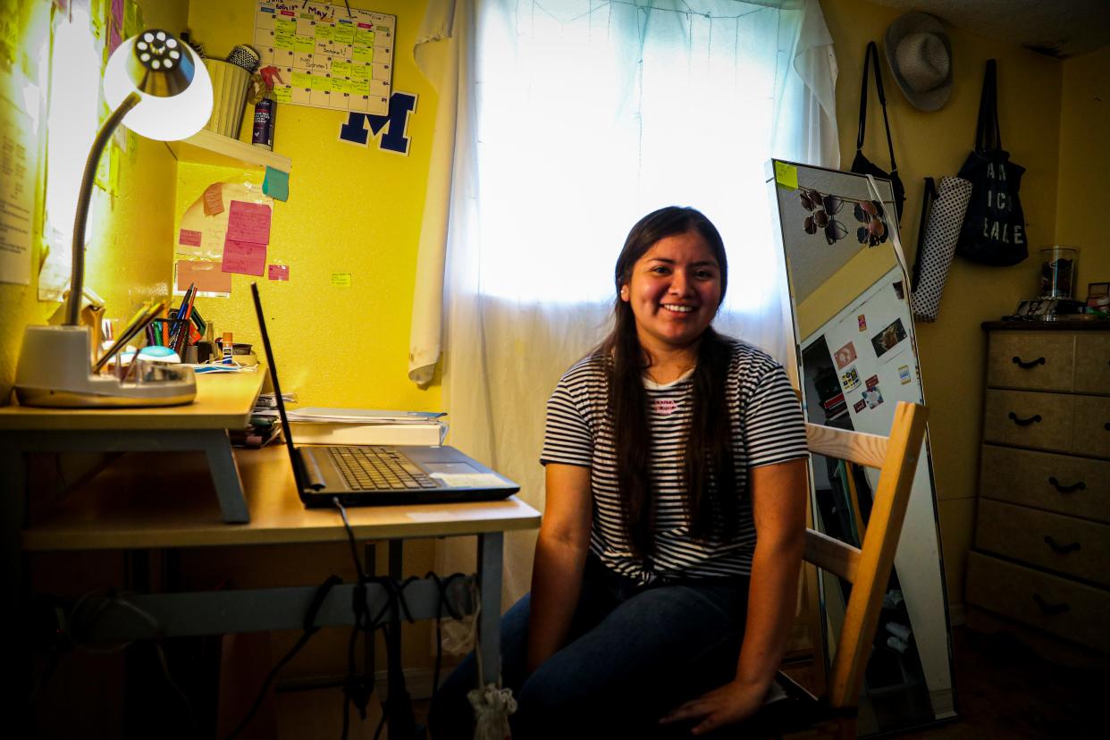 Luz Vazquez Hernandez in her room in Mulberry, Florida. This is where she spent most of her time working on homework during the pandemic. She was taking three AP classes during virtual school, which she balanced with working during the school day in the fields. This spring she graduated with a 3.9 GPA.