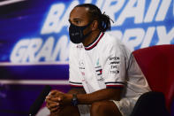 FILE - In this Thursday, Nov. 26, 2020 file photo Mercedes driver Lewis Hamilton of Britain participates in a media conference prior to the Bahrain Formula One Grand Prix at the International Circuit in Sakhir, Bahrain. The Bahrain Formula One Grand Prix will take place on Sunday. World champion Lewis Hamilton tested positive for COVID-19 and will miss the Sakhir Grand Prix this weekend, his Mercedes-AMG Petronas F1 Team said Tuesday Dec. 1, 2020. (Mario Renzi, Pool via AP, File)