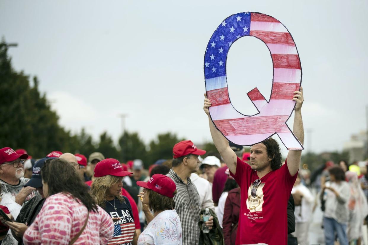 <span class="caption">It's not clear exactly how many people believe or follow QAnon.</span> <span class="attribution"><a class="link " href="https://newsroom.ap.org/detail/FacebookQAnon/ab23d0c7f20047a3a9904b90ac258454/photo" rel="nofollow noopener" target="_blank" data-ylk="slk:AP Photo/Matt Rourke;elm:context_link;itc:0;sec:content-canvas">AP Photo/Matt Rourke</a></span>