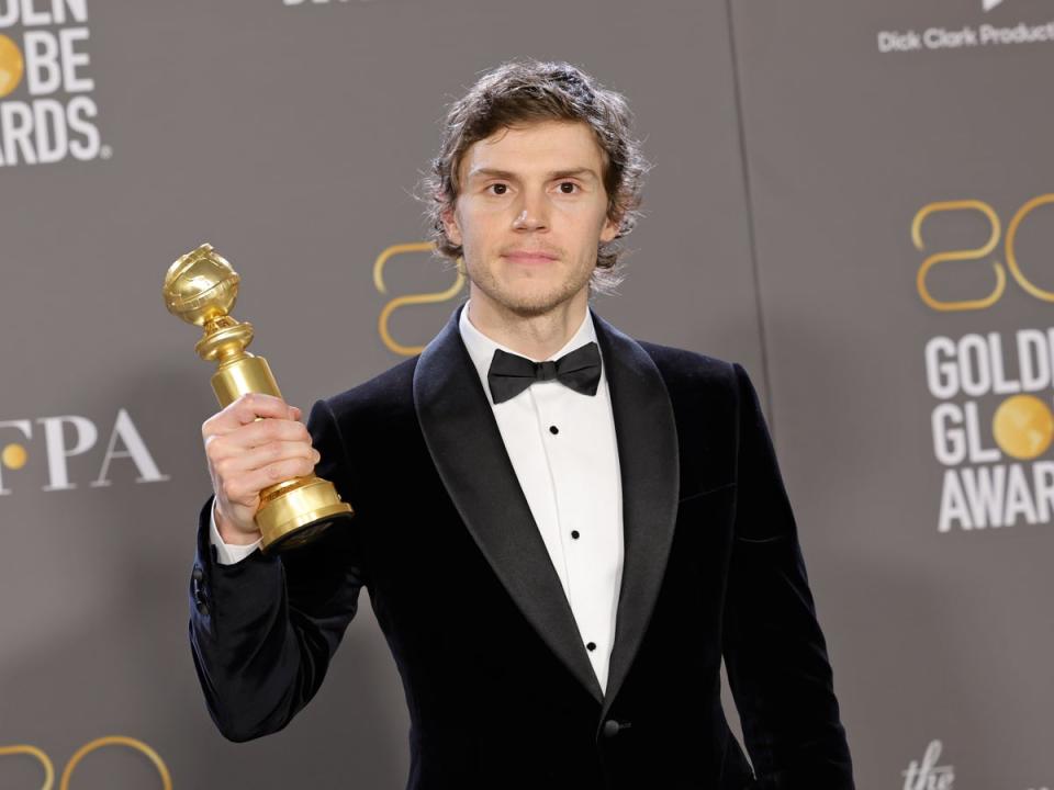 Evan Peters with his Golden Globe trophy for Best Actor in a Limited or Anthology Series (Getty Images)