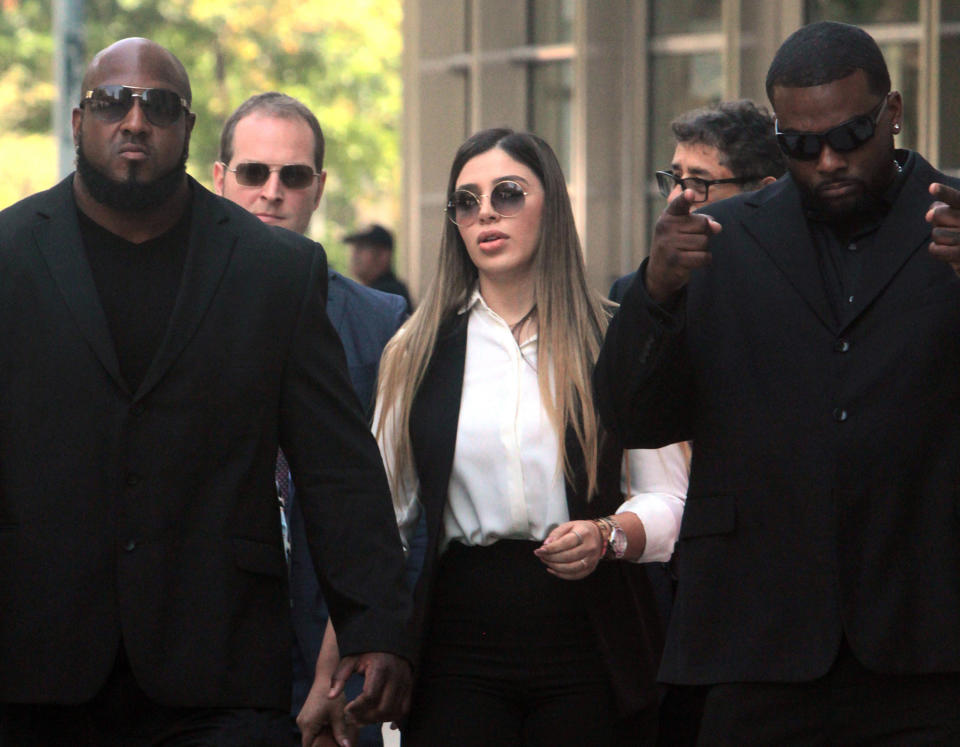 Emma Coronel Aispuro, 30, wife of the notorious drug lord Joaquin "El Chapo" Guzman, leaves Brooklyn Federal Court surrounded by bodyguards after her husband was sentenced to life plus 30 years in New York on July 17, 2019. Coronel Aispuro was arrested Monday, Feb. 22, 2021 in Virginia, according to the U.S. Justice Department. (Jesse Ward/New York Daily News/Tribune News Service via Getty Images)