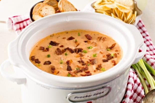 <p><a href="https://www.julieseatsandtreats.com/slow-cooker-bacon-cheesy-bbq-chicken-dip/" rel="nofollow noopener" target="_blank" data-ylk="slk:Julie's Eats and Treats;elm:context_link;itc:0;sec:content-canvas" class="link ">Julie's Eats and Treats</a></p>