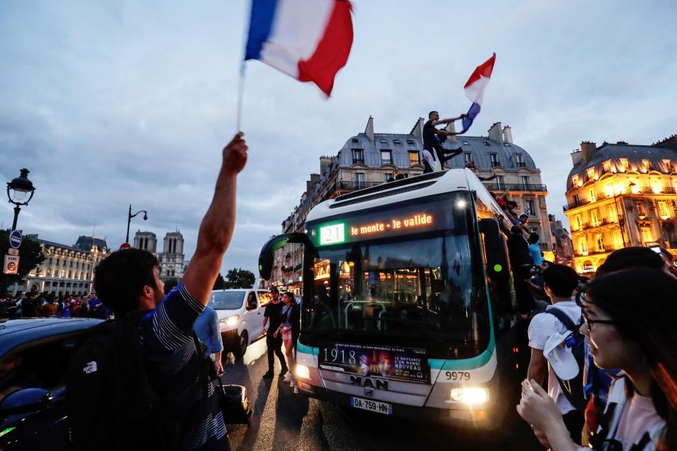 <p>People celebrate France’s victory in central Paris on July 10, 2018 after the final whistle of the Russia 2018 World Cup semi-final football match between France and Belgium. (Photo by Thomas SAMSON / AFP) </p>