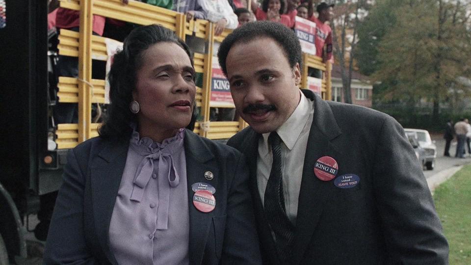 Coretta Scott King and her son Martin Luther King III confer at a rally of his supporters in Atlanta on Nov. 4, 1986.  / Credit: AP Photo/Joe Holloway Jr.