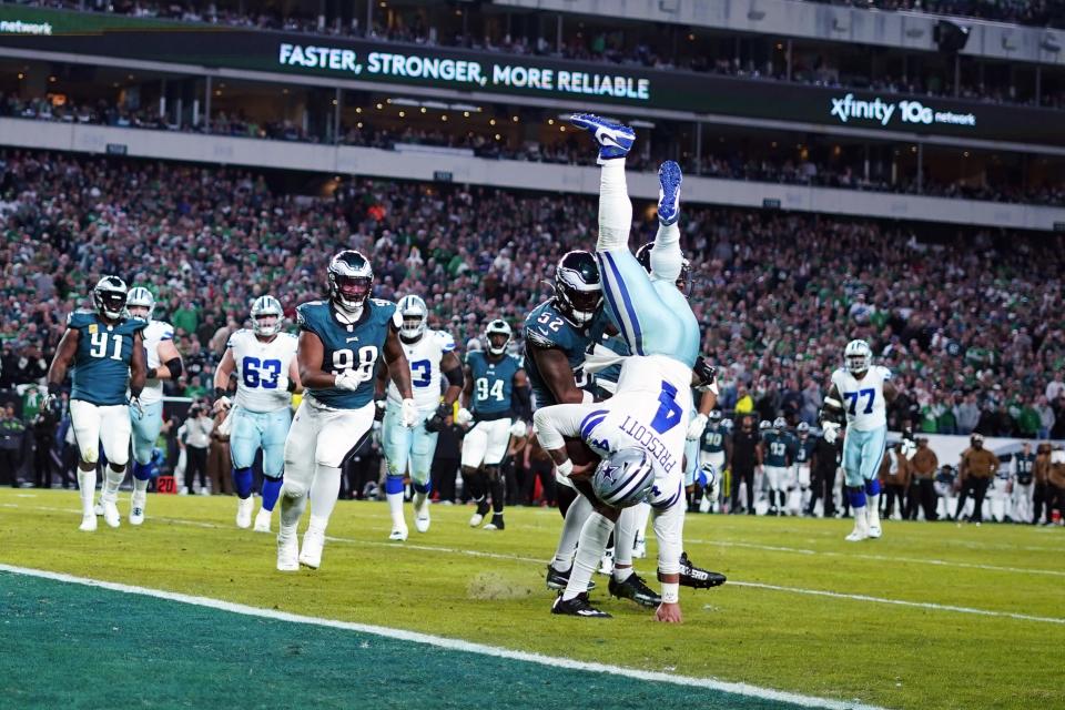 Dallas Cowboys quarterback Dak Prescott (4) falls with the ball during the second half of an NFL football game against the Philadelphia Eagles on Sunday, Nov. 5, 2023, in Philadelphia. (AP Photo/Matt Rourke)