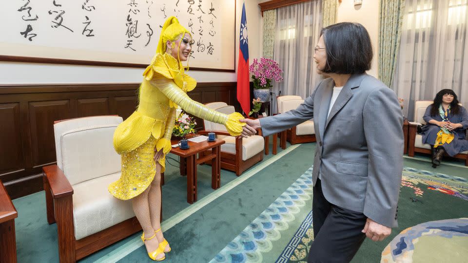 Taiwanese drag queen Nymphia Wind shakes hands with Taiwan's outgoing leader Tsai Ing-wen. - Wang Yu Ching/Office of the President
