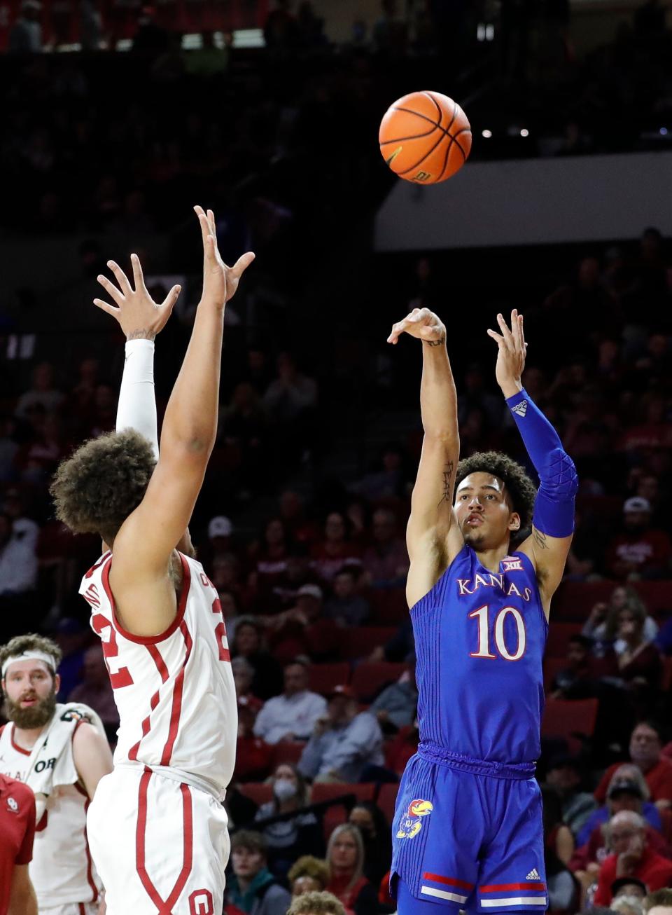 Kansas Jayhawks forward Jalen Wilson shoots as Oklahoma Sooners guard C.J. Noland defends during the first half at Lloyd Noble Center on Tuesday in Norman, Oklahoma.