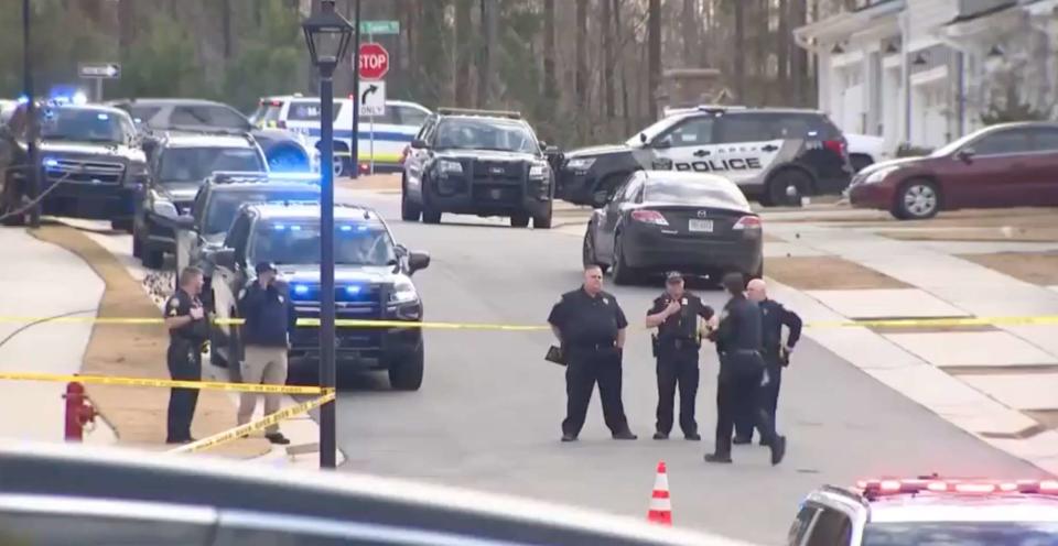 <p>WRAL</p> The Apex, N.C. neighborhood was cordoned off by police Monday afternoon, following the fatal shooting of two residents and a dog.
