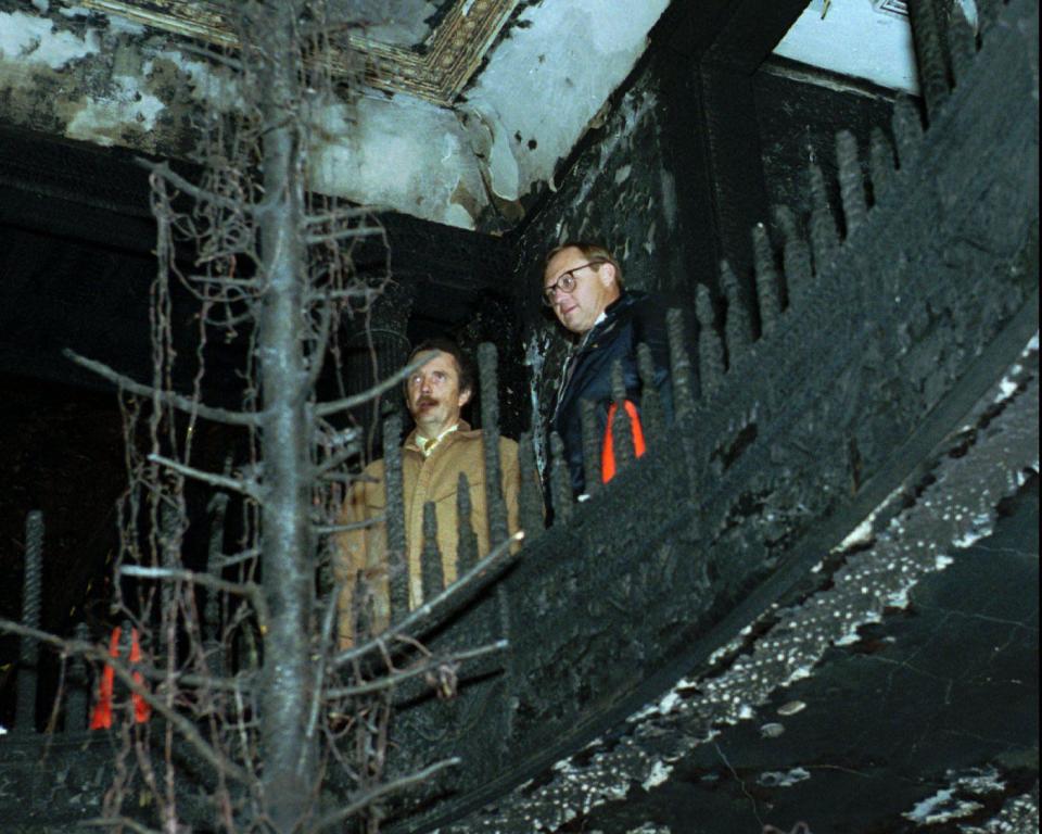 State Fire Marshalls Lynn Borg and Gary Whitney, with the Department of Public Safety, look over a burned tree inside the Governor’s Mansion after a Christmas tree fire on Dec. 15, 1993, in Salt Lake City, Utah. | Jeffrey D. Allred, Deseret News