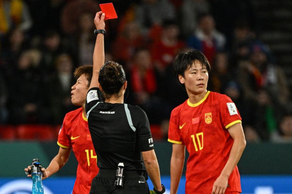 Spain's referee Marta Huerta de Aza shows a red card to China's midfielder Zhang Rui (AFP via Getty Images)