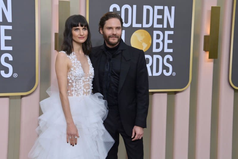 Daniel Brühl (R) and Felicitas Rombold attend the Golden Globe Awards in 2023. File Photo by Jim Ruymen/UPI