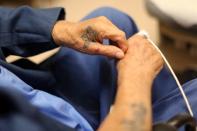 Inmate Richard Arriola, 88, has medical tests at the California Health Care Facility in Stockton, California, U.S., May 24, 2018. REUTERS/Lucy Nicholson