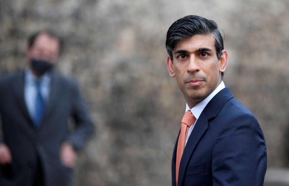 Britain's Chancellor of the Exchequer Rishi Sunak looks on as he leaves following an outside broadcast interview, in London, Britain, November 26, 2020. REUTERS/Toby Melville