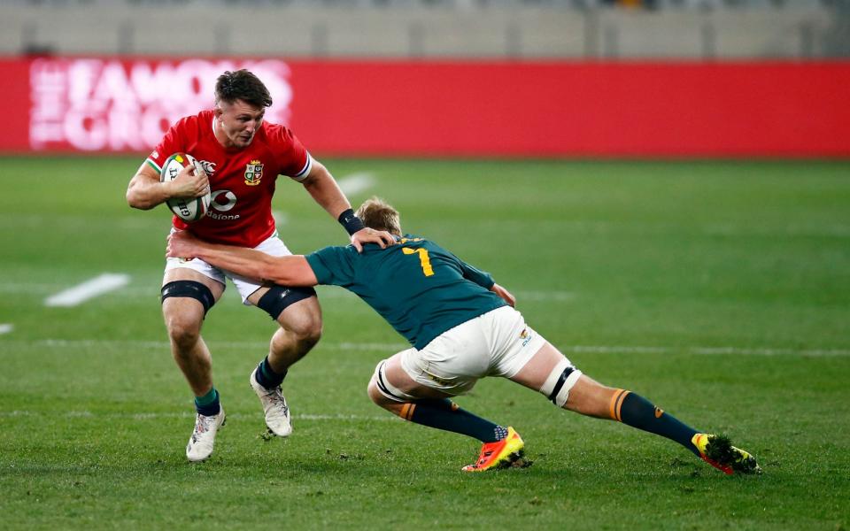 Pieter-Steph du Toit of South Africa tackling Tom Curry - PA