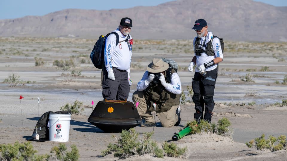 NASA Sample Return Capsule Science Lead Scott Sandford, NASA Astromaterials Curator Francis McCubbin and University of Arizona OSIRIS-REx Principal Investigator Dante Lauretta (left to right) collected air and dirt particles and captured images shortly after the capsule landed. - Keegan Barber/NASA