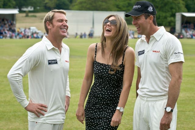 Shane Warne shares a joke with Elizabeth Hurley and England’s Michael Vaughan