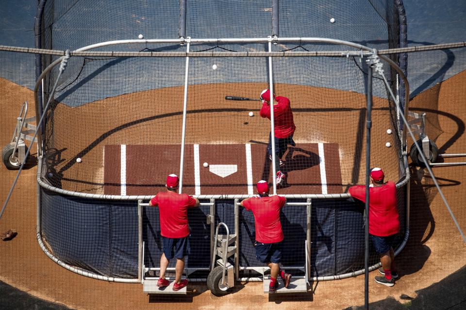 Washington Nationals' Anibal Sanchez, top, bats as the team holds its first baseball training camp workout at Nationals Stadium, Friday, July 3, 2020, in Washington. (AP Photo/Andrew Harnik)