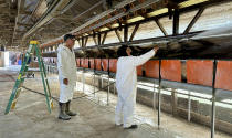 Mike Weber watches an employee clean a hen house at his egg farm in Petaluma, Calif. on Thursday, Jan. 11, 2024. His company Sunrise Farms had to euthanize 550,000 chickens after avian flu was detected among the flock. A year after the bird flu led to record egg prices and widespread shortages, the disease known as highly pathogenic avian influenza is wreaking havoc in California, which escaped the earlier wave of outbreaks that that devastated poultry farms in the Midwest. (AP Photo/Terry Chea)