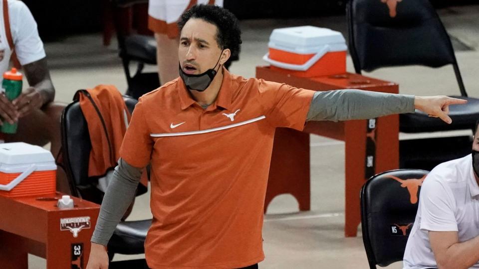 Mandatory Credit: Photo by Chuck Burton/AP/Shutterstock (11713753b)Texas head coach Shaka Smart directs his team against Kansas State during the first half of an NCAA college basketball game in Austin, TexasKansas St Texas Basketball, Austin, United States - 17 Jan 2021.