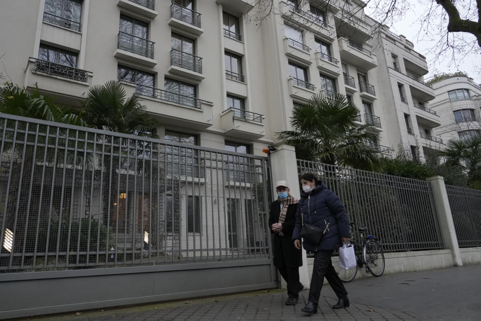 People walk past a Orpea Group nursing home Wednesday, Jan. 26, 2022 in Neuilly-sur-Seine, outside Paris. France's government pledged Wednesday to investigate what it called "absolutely revolting" allegations that a world leader in care for older adults has been putting profit before quality, rationing food and other items for nursing home residents. Orpea, with more than 1,100 care homes in 23 countries, has vigorously denied the accusations of shoddy and rapacious care which have battered its stock-market value in Paris this week and are detailed in an investigative journalist's book published Wednesday Jan;26, 2022. (AP Photo/Thibault Camus)