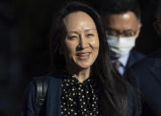 Meng Wanzhou, chief financial officer of Huawei, smiles as she leaves her home in Vancouver on Friday, Sept. 24, 2021. (Darryl Dyck/The Canadian Press via AP)