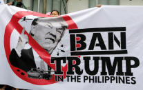 <p>Protesters display a banner during a rally against U.S. President Donald Trump’s visit, outside the Trump Tower in Makati, Metro Manila, Philippines, Nov. 9, 2017. (Photo: Erik De Castro/Reuters) </p>