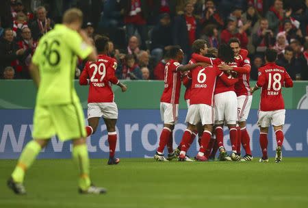 Football Soccer - Bayern Munich v FC Augsburg - German Cup (DFB Pokal) - Allianz Arena, Munich, Germany - 26/10/16 - Bayern players react after Philipp Lahm scored a goal. REUTERS/Michael Dalder