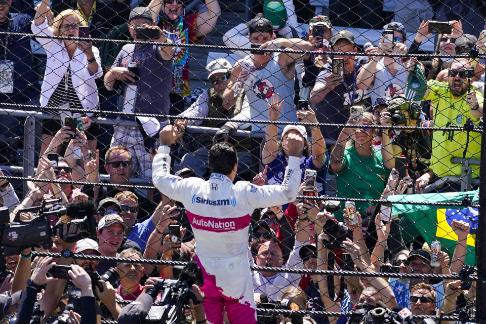 Helio Castroneves of Brazil celebrates after winning the Indianapolis 500 auto race at Indianapolis Motor Speedway in Indianapolis, Sunday, May 30, 2021. (AP Photo/Darron Cummings)