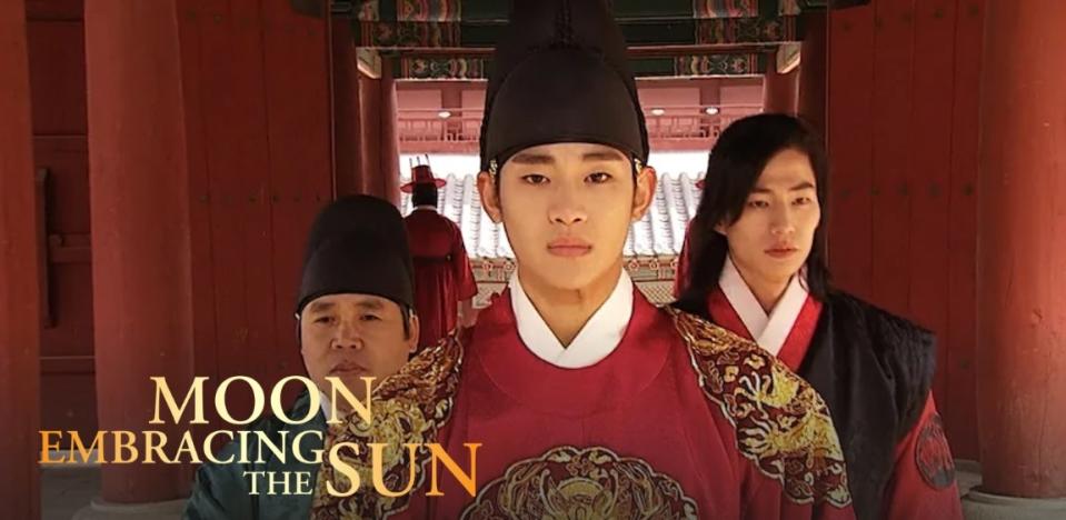 Three men in traditional Korean dress, standing in a Korean palace