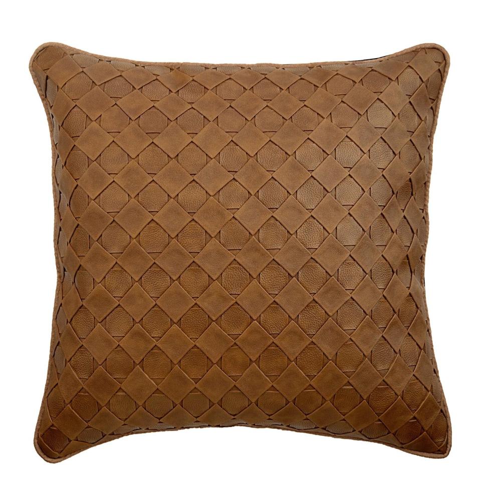 This 16 x 16 faux leather&nbsp;pillow cover has a textured pattern and suede background. <strong><a href="https://fave.co/2ZdeHaB" target="_blank" rel="noopener noreferrer">Find it for $27 on Etsy</a></strong>.