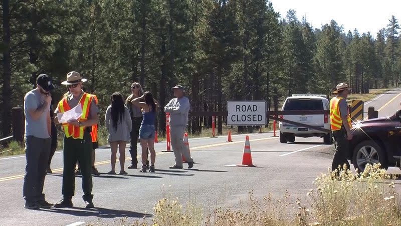 Park service workers and rangers at a roadblock give tourists information on what else there is to see and do in the area. Bryce Canyon National Park is closed due to the government partial shutdown.