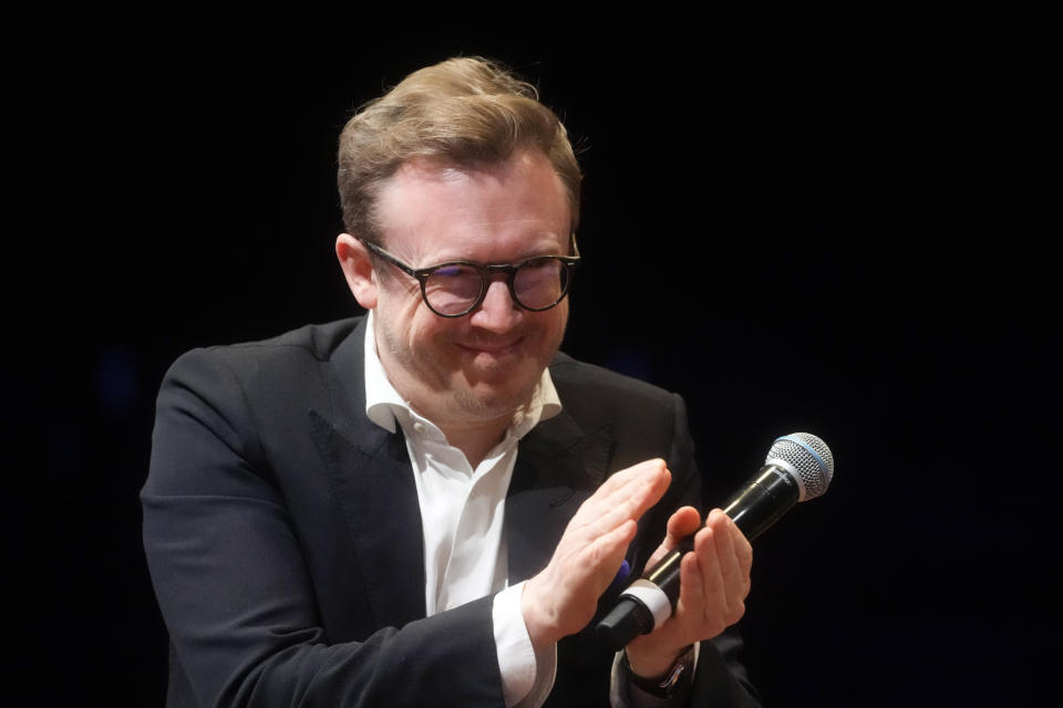 Maestro Daniel Harding, the new music director of Rome's Santa Cecilia orchestra, claps his hands during a press conference on the occasion of his presentation to media in Rome, Monday, March 6, 2023. British conductor Daniel Harding was named Monday as music director of Rome’s Orchestra dell’Accademia di Santa Cecilia, starting in the fall of 2024. The 47-year-old conductor Harding, who has a second career as an Air France pilot, had an unusually young start as a conductor, and will arrive at the Santa Cecilia orchestra after 17 years as the principal conductor of the Swedish Radio Symphony Orchestra.(AP Photo/Gregorio Borgia)