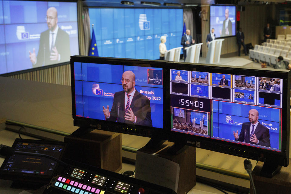 European Council President Charles Michel, on a screen, speaks during a news conference after the second day's session of an extraordinary meeting of EU leaders to discuss Ukraine, energy and food security at the Europa building in Brussels, Tuesday, May 31, 2022. (AP Photo/Olivier Matthys)