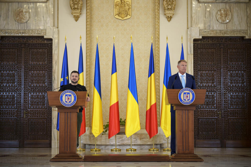 Ukraine's President Volodymyr Zelenskyy, left, attends joint press statements with Romanian President Klaus Iohannis, right, at the Cotroceni Presidential Palace in Bucharest, Romania, Tuesday, Oct. 10, 2023. (AP Photo/Andreea Alexandru)