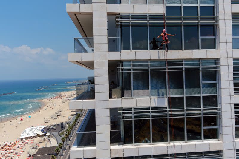 Squeegee Selfies: A TikTok star rises on Tel Aviv towers