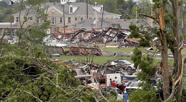 Volunteers and officials search through the destruction near Van Intermediate School after a tornado in Van, Texas. The small city of Van was struck by a tornado in the evening of May 10, leaving at least two dead and more missing. Photo: Ron Jenkins/Getty