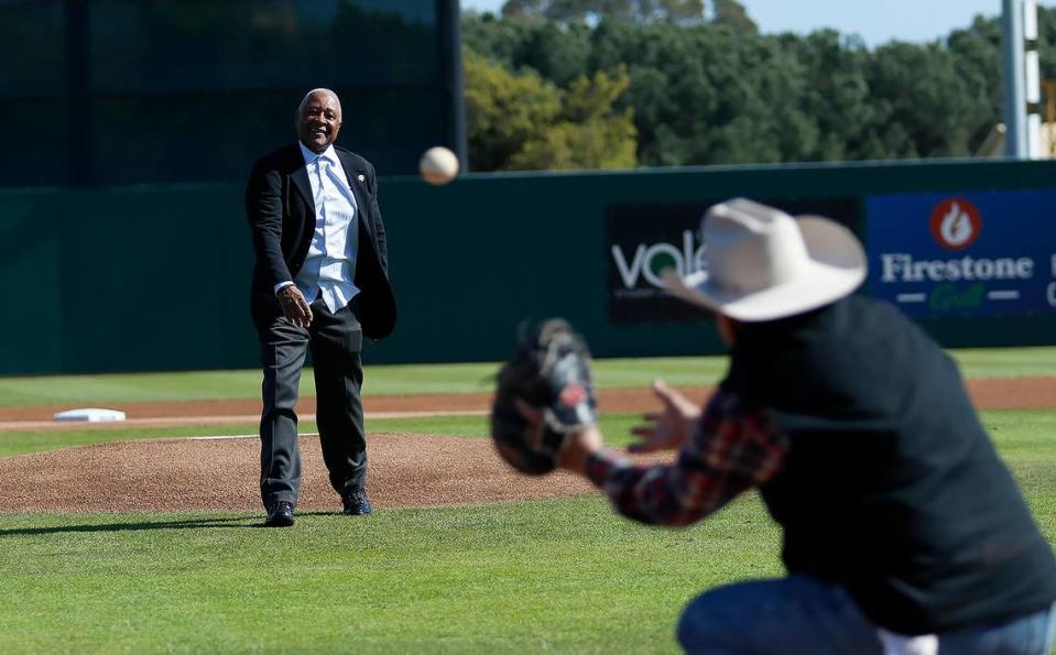 Ozzie Smith throws out the first pitch at Cal Poly’s baseball game against UC Irvine after the re-dedication of his statue and plaza at Baggett Stadium on March 25. 2023.