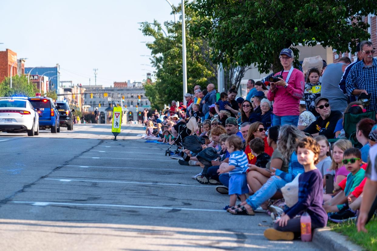 Spectators line Huron Avenue to watch the Rotary International  Day Parade during Boat Week Wednesday, July 21, 2021, in Port Huron.