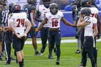 Louisville running back Javian Hawkins (10) celebrates with teammates after making a long touchdown run against Pittsburgh during the first half of an NCAA college football game, Saturday, Sept. 26, 2020, in Pittsburgh. (AP Photo/Keith Srakocic)